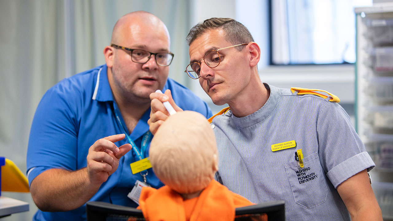 Child Nursing skills session. Nursing and midwifery facilities. 2 male nurses