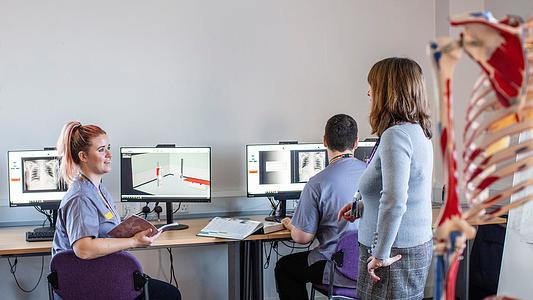 Diagnostic radiography students in a computer lab