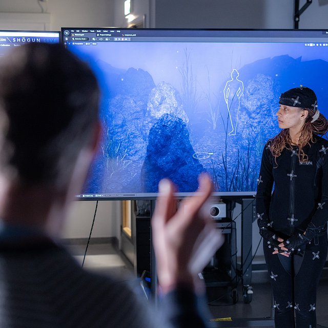 Acting student Shay Jones using the motion capture suite in the Immersive Media Laboratory.
