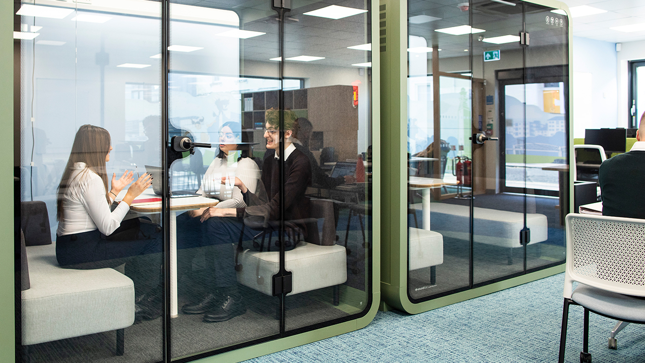 Law clinic students using sound proof booths
