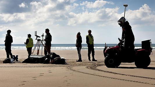 Members of the University’s Coastal Processes Research Group conducting a full embayment survey at Perranporth, Cornwall. (Lloyd Russell, University of Plymouth)