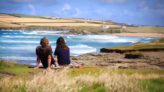 Two students sat on the cliffs watching the sea