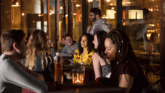 Explore Plymouth - top 15 best student city. Students enjoying a night out in a bar